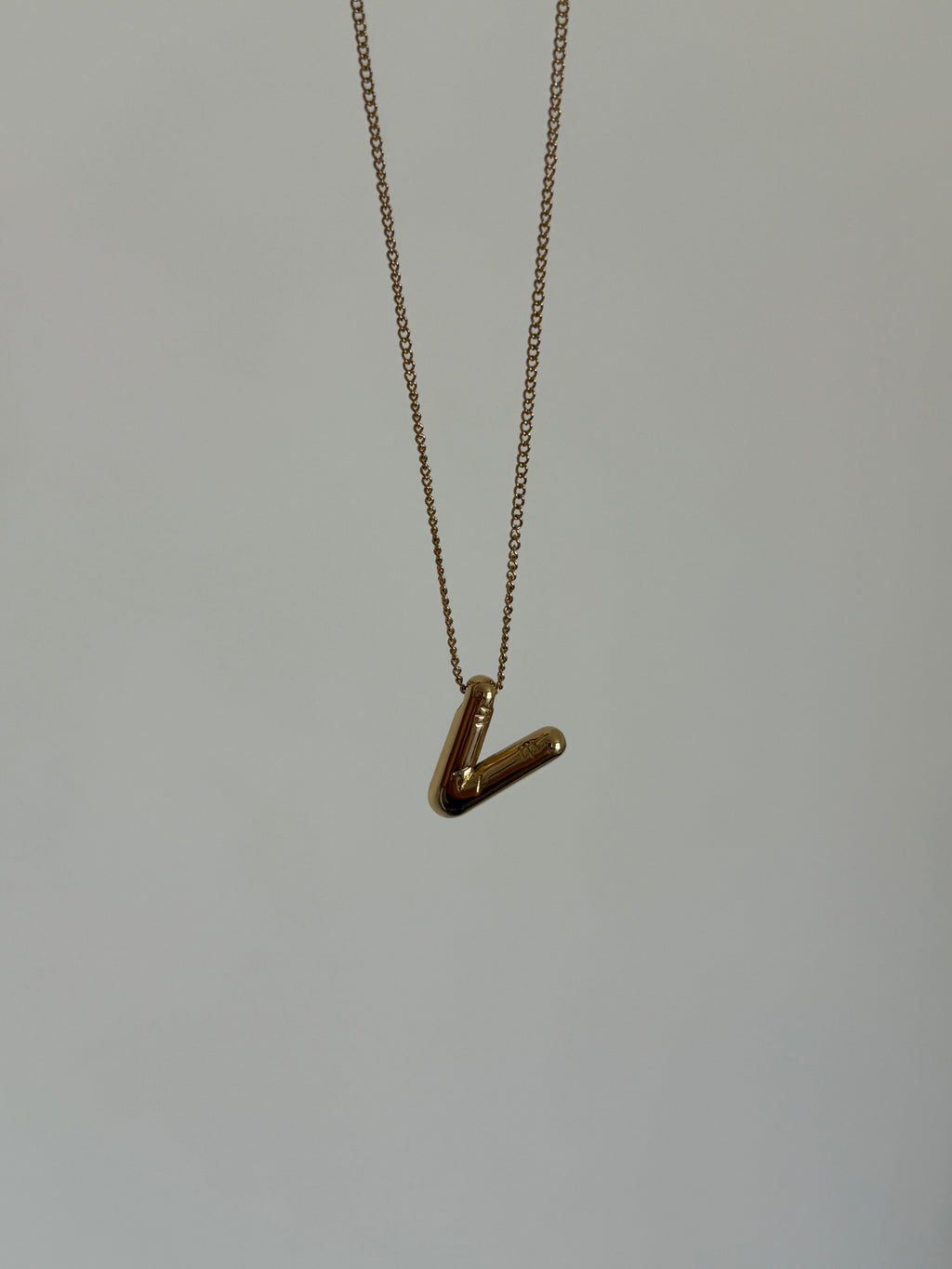 Gold balloon initial necklace