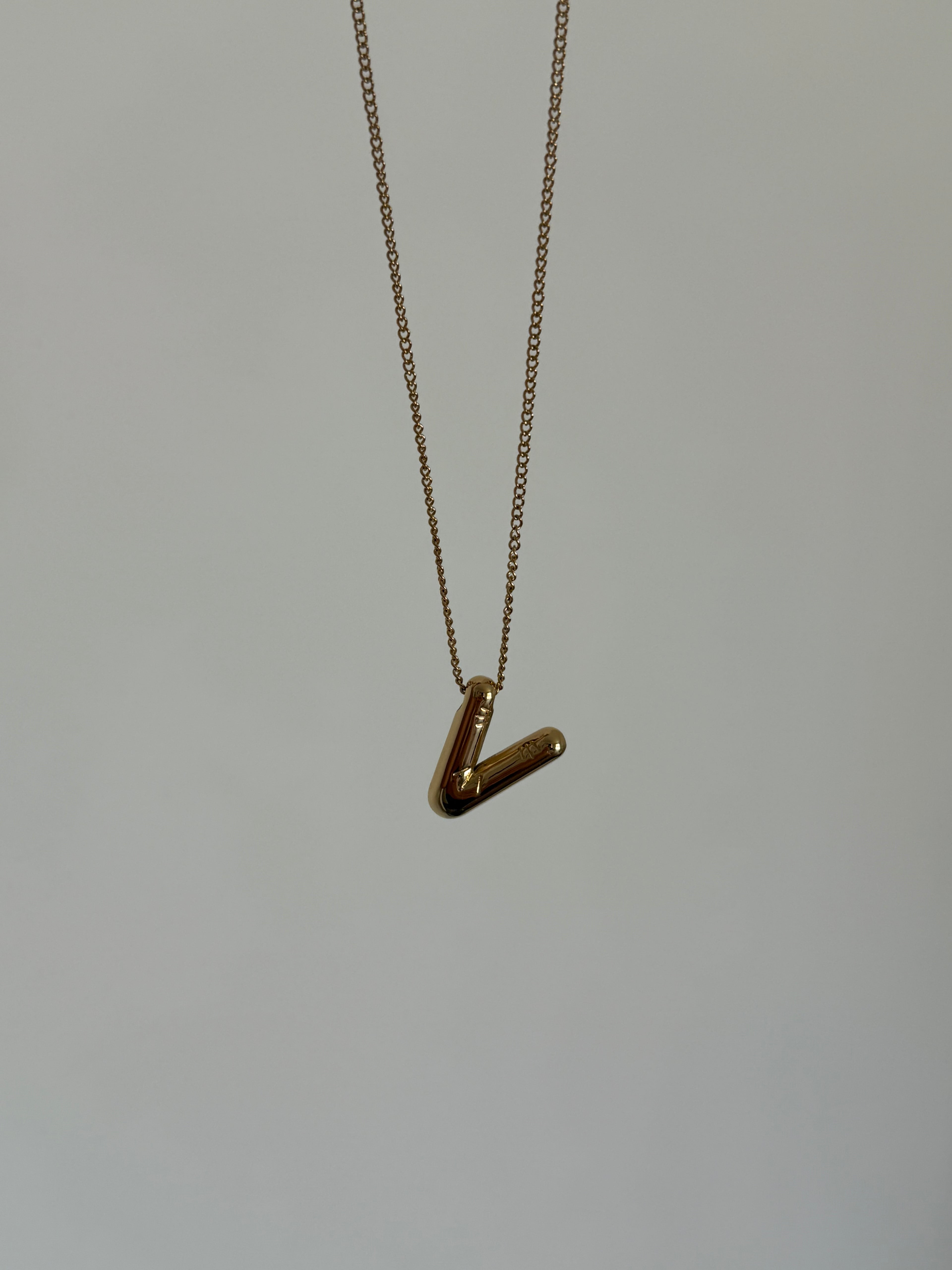 Gold balloon initial necklace